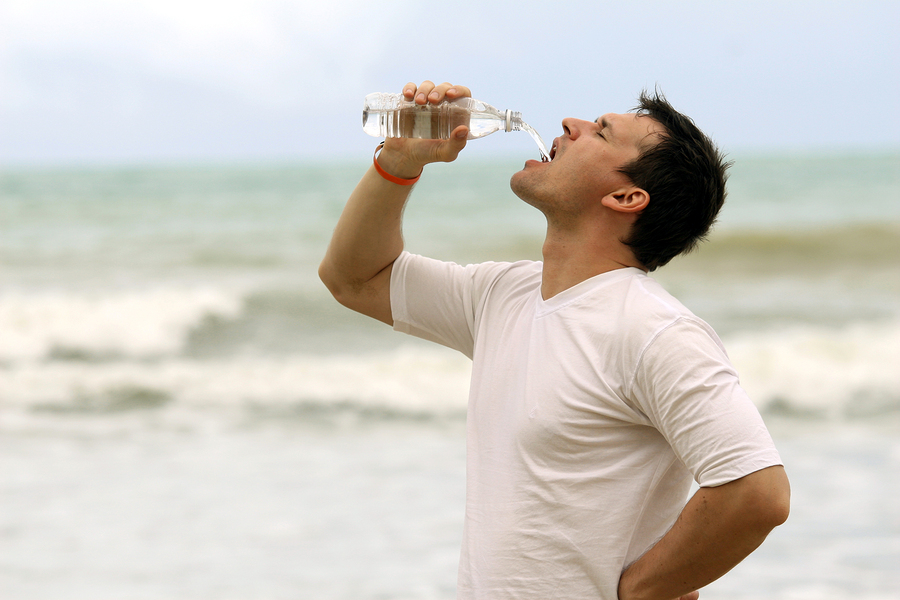 man drinking water after sport training outdoor