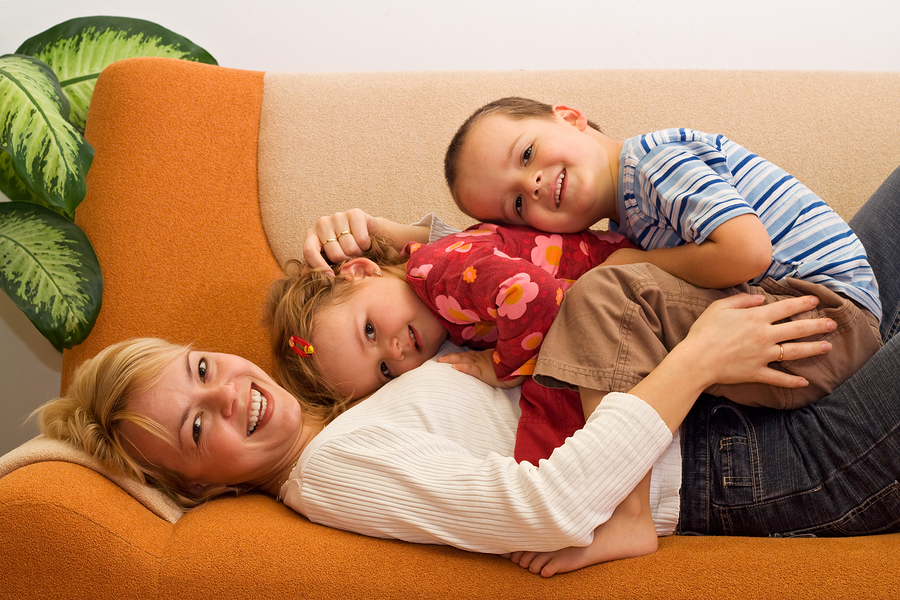 Happy woman and kids having fun indoors